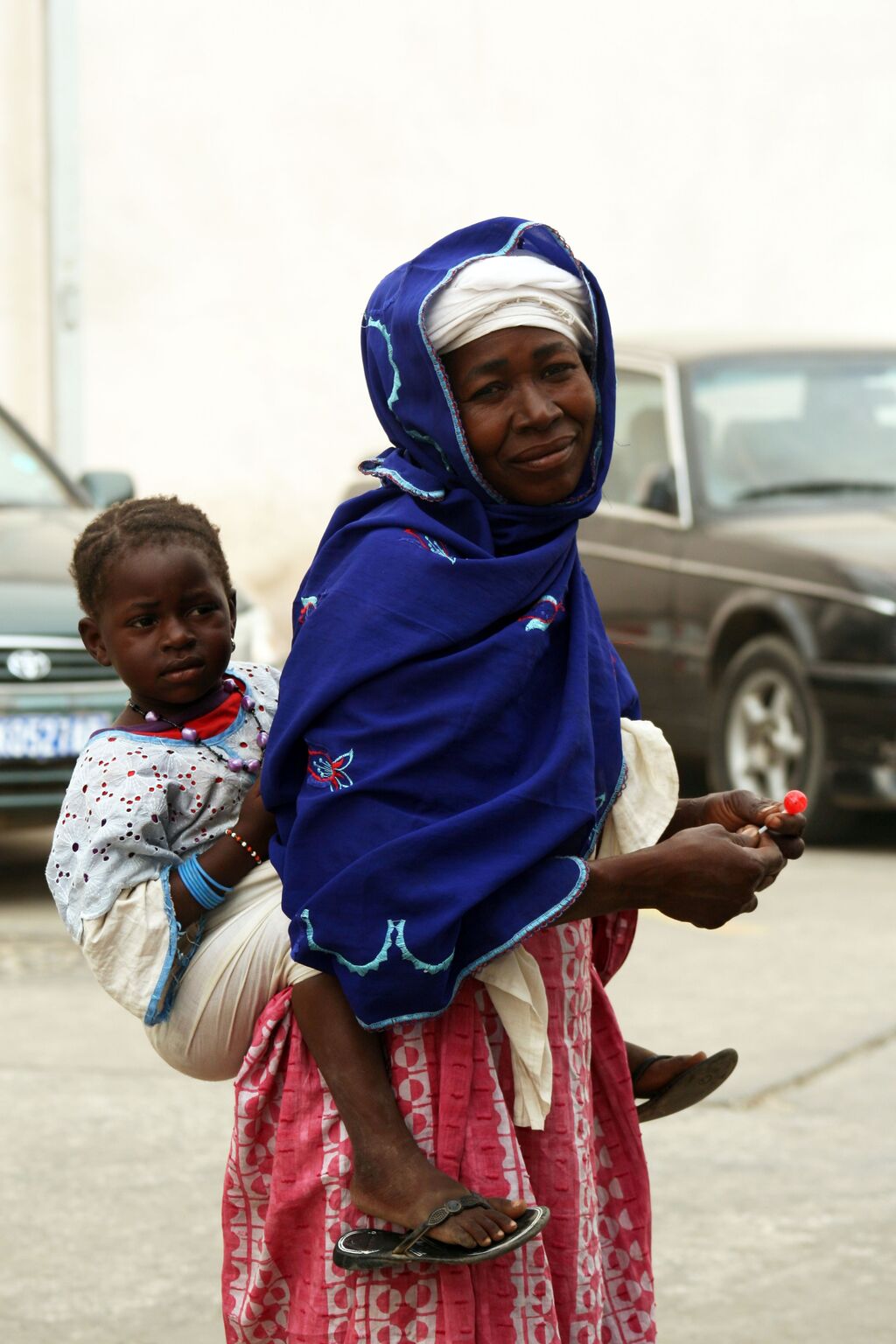 Woman with child on her back, Senegal, Saint Louis